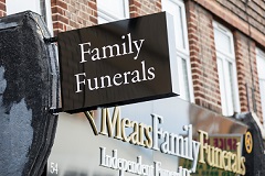 Eltham funeral home sign post